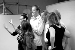 Core members of the Emerge team form a “human machine” as part of an improv game to express their roles in Emerge.